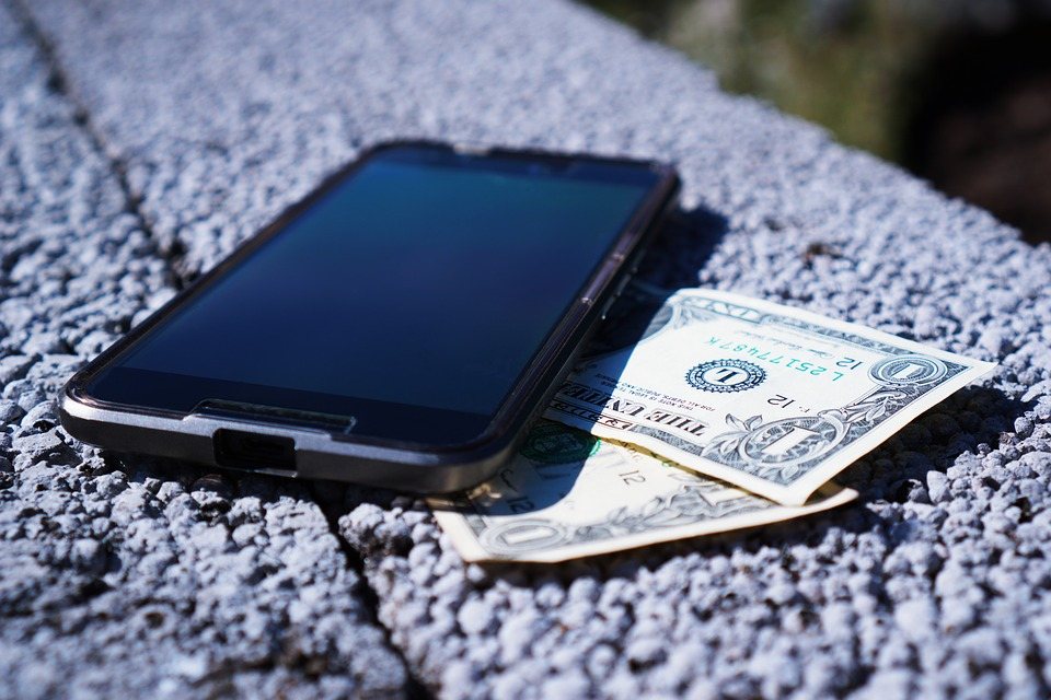 apple ios iphone with dollar bills for non profit financial plan