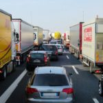 traffic jam with cars and trucks on busy highway