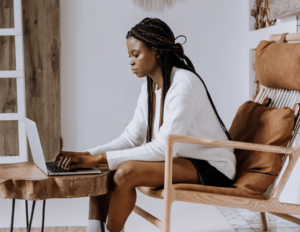 black lady looking at laptop