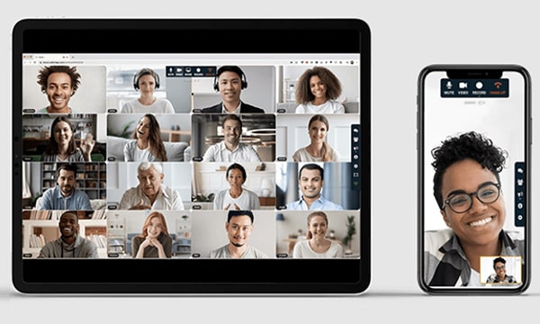 Beauty shot of tablet with FreeConference.com Gallery View and mobile displaying Speaker View with picture-in-picture