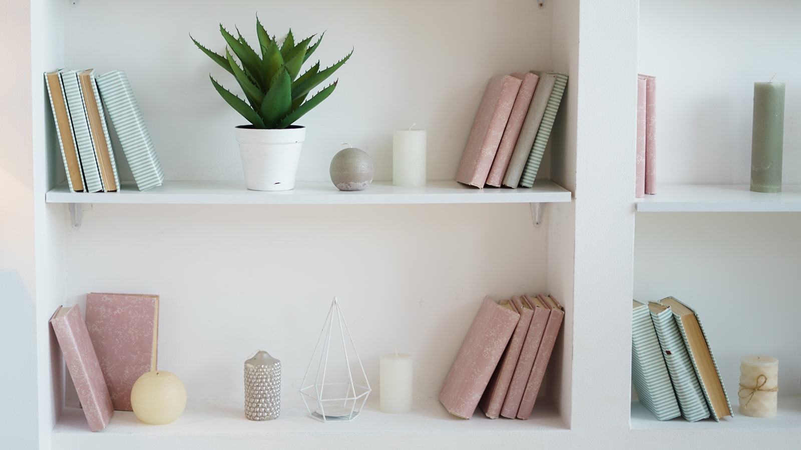 Pretty books on bookshelves background-min